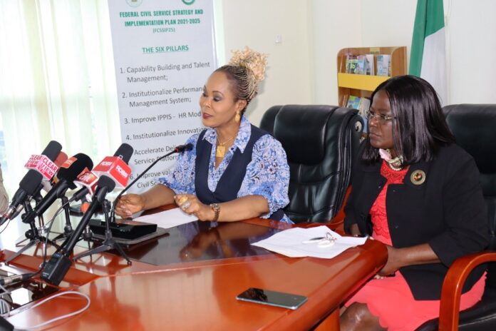 Honourable Minister of Women Affairs, Barrister (Mrs) Uju Kennedy-Ohanenye addressing journalists at the briefing. To her left is the Director, Women Development Department, Mrs. Funke Oladipo