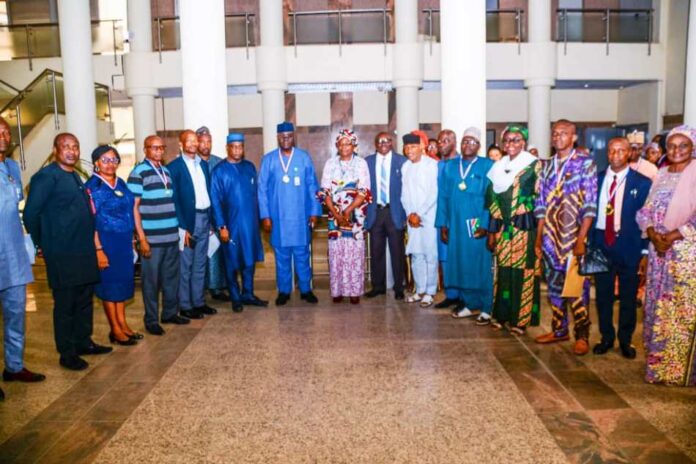 Permanent Secretary, Federal Ministry of Humanitarian Affairs and Poverty Alleviation, Abel Enitan, inaugurates 15 - Man Committee on Reforms and Innovation and Awards Outstanding Staff of the Ministry in Abuja.