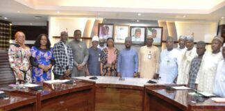 The Permanent Secretary, FMAFS, Mr Temitope Fashedemi (C), and Members of the Committee during the inauguration ceremony.