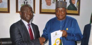 L-R: Permanent Secretary, Ministry of Police Affairs, Mr James Sule receiving the hand over Document from the immediate past Permanent Secretary of the Ministry, Dr Nasir Sani Gwarzo, during the handover and taking-over ceremony, held at the Ministry Headquarters yesterday in Abuja