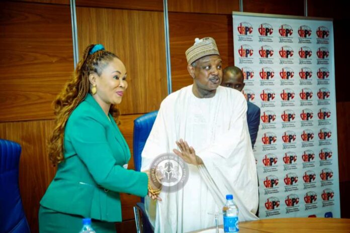 Honourable Minister of Women Affairs, Barrister (Mrs) Uju Kennedy-Ohanenye welcoming the Honourable Minister of Budget and Economic Planning, Senator Abubakar Bagudu, to the 2nd Meeting of the High-Level Advisory Council on the Support of Women and Girls in Nigeria held today in Abuja