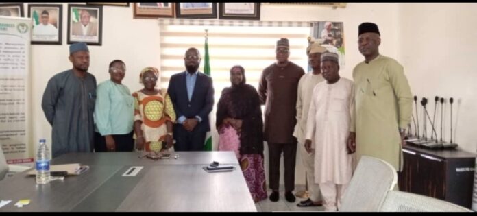 The Acting Executive Director, NIWRMC, Mrs Sakinatu Abbo Jimeta (M), Management Staff of the Commission and representatives of Nigerian Breweries PLC in a group photograph