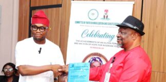 Director General, Committee on Youth Moblization and Sensitization, Obinna Nwaka (l), presents proposal collaboration with Federal Ministry of Special Duties and Inter-governmental Affairs to Director, Policy Implementation and Monitoring of Government Decisions, Dr. Cyprian Kpakol, rep. of the PS.