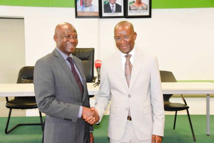 Hon. Minister of Sport Development, Sen. John Owan Enoh, in a handshake with the Chairman of Investigative committee on the various negative exposure to the country at the Paris 2024 Olympics and Paralympic Games, Dr. Mumini Alao, after the inauguration of the committee in Abuja on Wednesday, 25th September, 2024