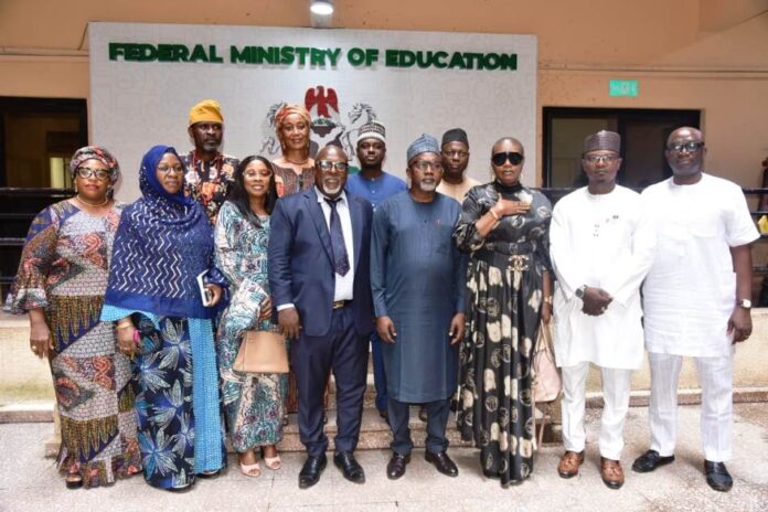 Hon. Minister of State for Education, Dr. Yusuf Tanko Sununu (4th right); with Chairman, National Institute for Nigerian Languages (NINLAN) Prof. Victor Ukaogo (4th left)in a group photograph with other dignitaries, during a courtesy visit to the Ministry in Abuja on Wednesday 11th September, 2024.