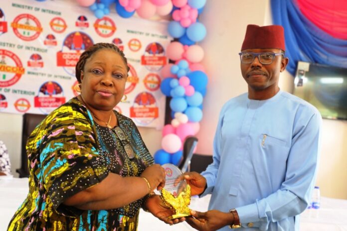 L-R: Mrs. Catherine Zosi, representative of the Permanent Secretary, Ministry of Interior and Mr. Emmanuel Attamah, representative of the Hon. Minister of Interior.