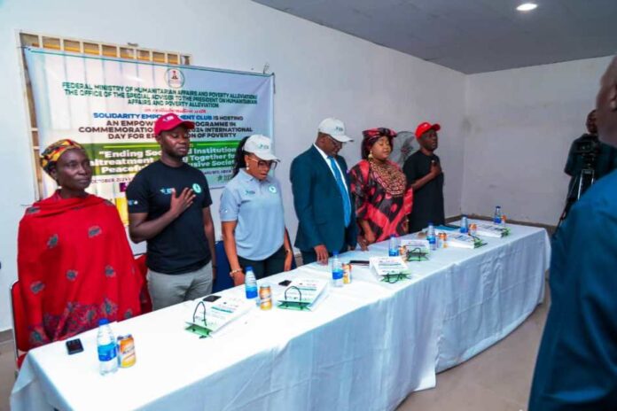 Members of the high table at the event (1st Right) Deputy Director overseeing the Office of the Director Social Development, FMHAPA Peter Audu , 2nd Right, SSA to the President on Humanitarian Affairs and Poverty Alleviation Hon. Delu Bulus Yakubu, Rep. Of the Permanent Secretary of the Ministry Odii Ndubuisi Barry, National Secretary Solidarity Empowerment Club Precious Jeje, Program Director Solidarity Empowerment Club and Woman leader, Karu Community