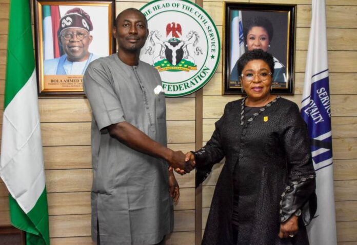 R-L: Head of the Civil Service of the Federation ((HCSF), Mrs Didi Esther Walson-Jack, OON, mni (R), in a handshake with the President of the Federal Public Service Games ( FEPSGA), Mr Aloku Amaebi when the latter and his excos met with the HCSF to brief her on preparations for the 2024 FEPSGA.