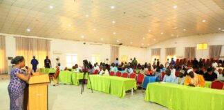 Dr. Vivian Okono, Director Mines Environmental Compliance Department addressing Mineral Title Holders, Mining Host Communities & Relevant Stakeholders during a Sensitisation Workshop on behalf of the Permanent Secretary, Ministry of Solid Minerals Development