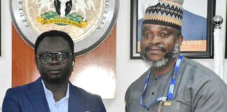 Minister of State for Youth Development, Comrade Ayodele Olawande (L), with the Country Director, Plan International, Mr Charles Usie, during the signing of an MoU between the Ministry and Plan International at the Minister of State office in Abuja on Thursday (10/10/24).