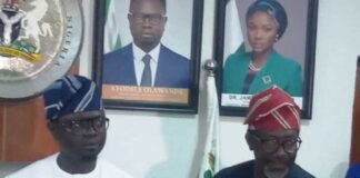 Left- right :The Honourable Minister of State, Federal Ministry of Youth Development, Comrade Ayodele Olawande and the Chief Executive, NAICOM, Olusegun Ayo Omosehin, displaying the signed MoU document in Abuja.