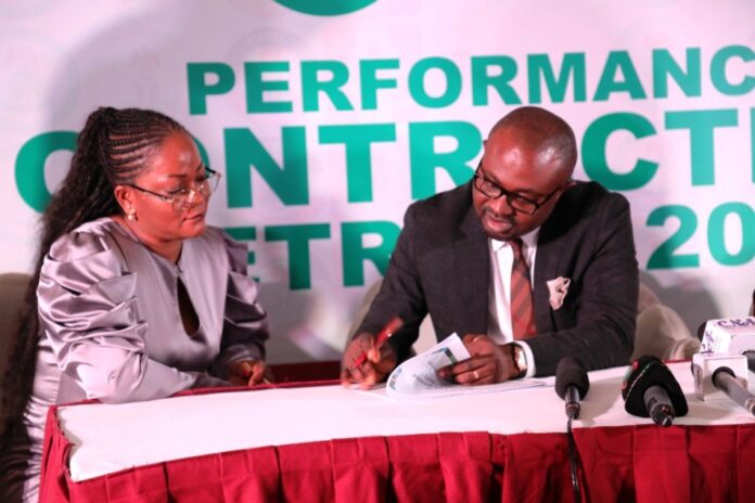 L-R: Engr Abisoye Coker-Odusote, DG/CEO, NIMC and Dr. Olubunmi Tunji-Ojo, Hon. Minister of Interior at the signing of a performance contract on Tuesday, 29 October 2024