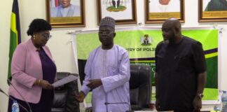 Director of Planning Research and Statistics, Mrs Azeez Margaret, and Permanent Secretary, Mr. James Sule official signing ceremony for the performance bond/contract with the Honourable Minister at the Headquarters of the Ministry in Abuja.