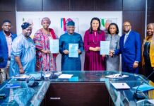 Group Photograph After The Signing of MoU between the Ministry, GCE HealthCare and JNCI: Middle: The Hon. Minister of State for Health & Social Welfare Dr. Tunji Alausa; on his right is the Permanent Secretary, Daju Kachollom mni; 2nd Left: Director Hospital Services Department Dr. Jimoh Salaudeen mni; on the Left of Hon. Minister is Mrs. Claire Omatseye, Managing Director JNCI .