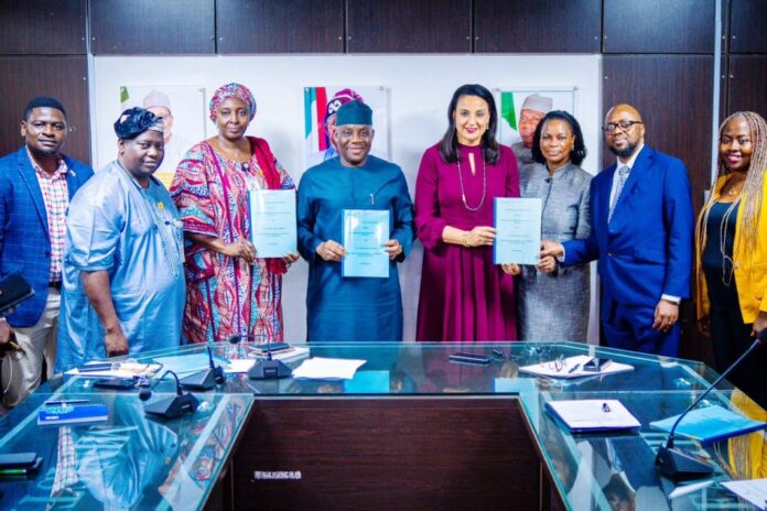 Group Photograph After The Signing of MoU between the Ministry, GCE HealthCare and JNCI: Middle: The Hon. Minister of State for Health & Social Welfare Dr. Tunji Alausa; on his right is the Permanent Secretary, Daju Kachollom mni; 2nd Left: Director Hospital Services Department Dr. Jimoh Salaudeen mni; on the Left of Hon. Minister is Mrs. Claire Omatseye, Managing Director JNCI .