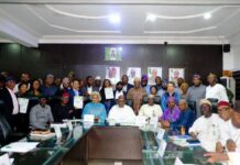 The Minister of Health and Social Welfare, Prof. Mohammed Ali Pate (C) and the representative of the Minister of Agriculture and Food Security, Director, Department of Planning and Policy Coordination, Mr Ibrahim Tanimu (Fifth from Left),during the launching of the New National Action Plan in Abuja.