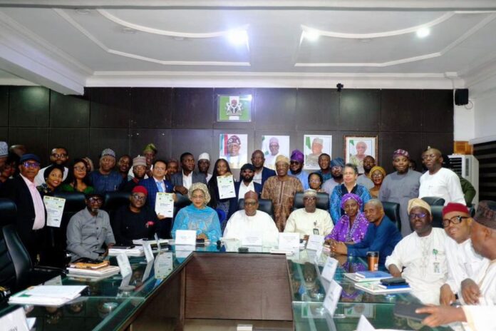 The Minister of Health and Social Welfare, Prof. Mohammed Ali Pate (C) and the representative of the Minister of Agriculture and Food Security, Director, Department of Planning and Policy Coordination, Mr Ibrahim Tanimu (Fifth from Left),during the launching of the New National Action Plan in Abuja.