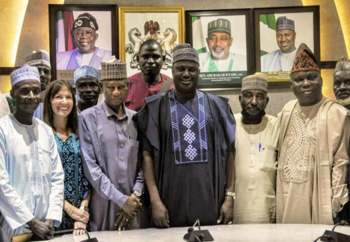 The Minister of State for Agriculture and Food Security, Sen Dr Aliyu Sabi Abdullahi (C), members of the National Tomato Grower's Processors and Marketers Association of Nigeria.