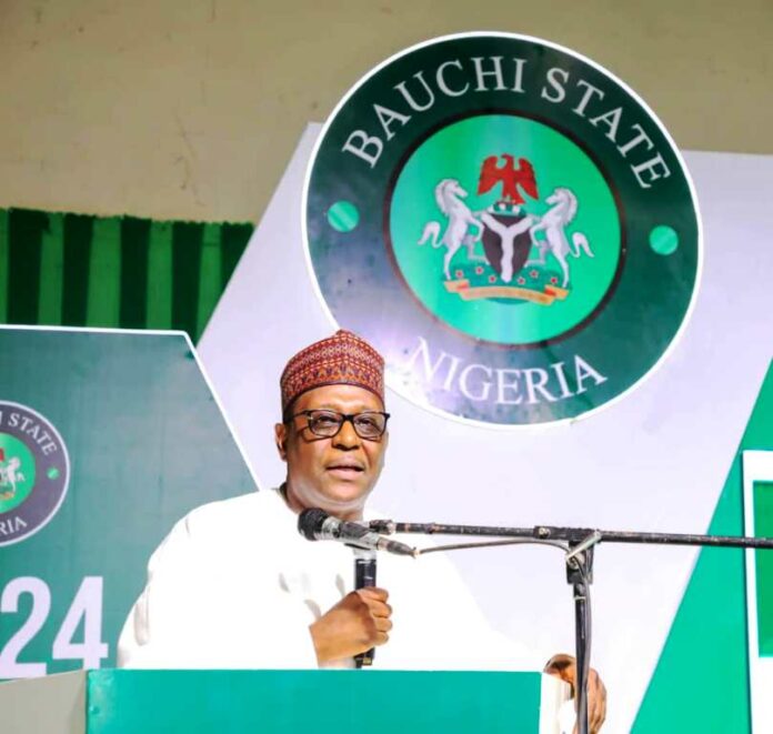 The Coordinating Minister for Health & Social Welfare, Prof. Muhammad Ali Pate addressing Staff and participants from the Ministry's agencies nationwide during the opening ceremony of 2024 Ministerial Leadership Retreat on Performance Management Systems in Bauchi State.