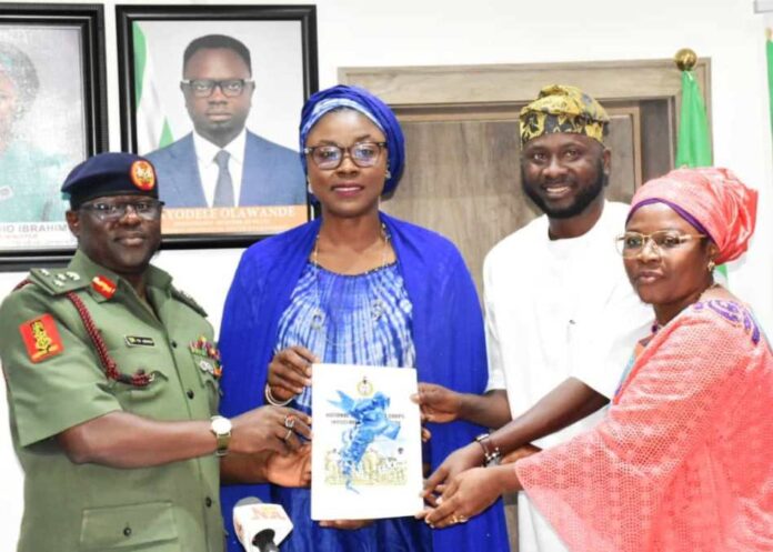 From left: Director-General, National Youth Service Corps (NYSC), Brig. -Gen. Yusha'u Ahmed; Minister of Youth Development, Dr Jamila Bio-Ibrahim; Chairman of the NYSC Reforms Committee, Kabir Oyekunle; and the Deputy Chairman, NYSC Reforms Committee, Mrs Bintu Garba, during the submission of the NYSC Reforms Committee report to the Minister in Abuja on Tuesday (8/10/24).