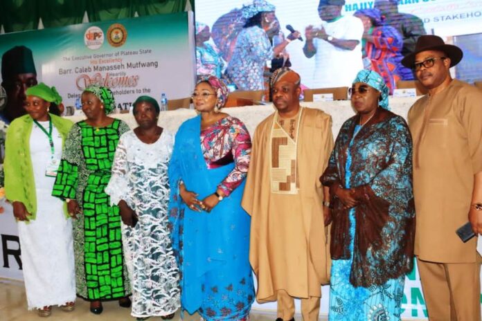 3rd from right, Ambassador Gabriel Aduda, Permanent Secretary, Federal Ministry of Women Affairs, Hajia Imaan Sulaiman-Ibrahim, fsi, Honourable Minister, FMWA, Rep. of the Plateau State Governor, Barr (Mrs) Olivia Daziam, and other dignitaries at the 24th Regular National Council on Women Affairs held in Jos, Plateau State