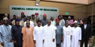 The group picture of the honourable Minister of Education Dr Morufu Olatunju Alausa wearing white cloth with black cap (to his L) the Senate Committee leader of tertiary Institutions Senator Munrari Danduts,( to his R)the Permanent Secretary Education Dr Nasir Sani-Gwarzo mni and other Committee members.