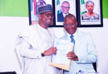 The outgoing Minister of Sport Development, Sen. John Owan Enoh and the newly appointed Chairman National Sports Commission, Mallam Shehu Dikko, during the handover ceremony held at the Media Centre, Moshood Abiola National Stadium, Abuja