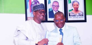 The outgoing Minister of Sport Development, Sen. John Owan Enoh and the newly appointed Chairman National Sports Commission, Mallam Shehu Dikko, during the handover ceremony held at the Media Centre, Moshood Abiola National Stadium, Abuja