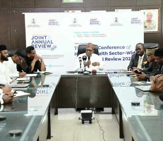 Ministerial Press Briefing on Forthcoming Joint Annual Review JAR meeting: Prof Muhammad Ali Pate Coordinating Minister for Health & Social Welfare addressing Journalists during the Briefing session held 6th Floor Conference Room @ the FMoH & SW Headquarters Office, Abuja: On his right is Dr Olubunmi Aribeana Director Food & Drugs Department, representing Permanent Secretary; On his Left; Dr. Kamil Shoretire, Director Health Planning Research & Statistics Department.