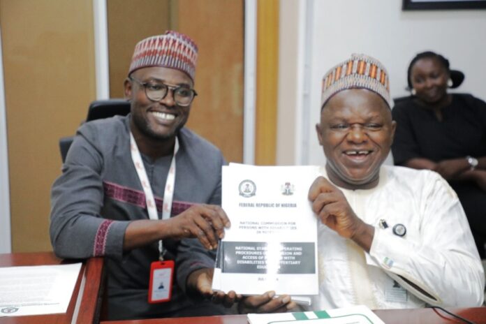 The Executive Secretary National Commission for Persons with Disabilities, Chief Ayuba Gufwan at Press time with the Country Director CBM Mr Abdulaziz Musa.