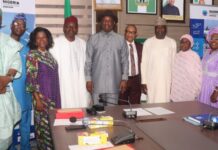 Hon, Minister, Ministry of Aviation and Aerospace Development and the Permanent Secretary in a group photograph. with retired Directors of the Ministry