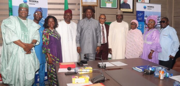 Hon, Minister, Ministry of Aviation and Aerospace Development and the Permanent Secretary in a group photograph. with retired Directors of the Ministry