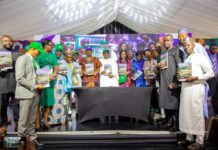 The Honourable Coordinating Minister for Health & Social Welfare Prof Muhammad Ali Pate launching the Nigeria Climate Change and Health Vulnerability Assessment Adaptation Report; on his right: Permanent Secretary Kachollom Daju mni; on her right is: Dr Okara Dogara, Technical Assistant to Permanent Secretary & other stakeholders/ participants at the JAR Conference.