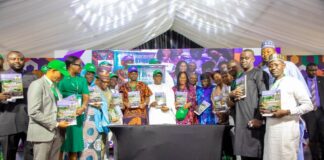 The Honourable Coordinating Minister for Health & Social Welfare Prof Muhammad Ali Pate launching the Nigeria Climate Change and Health Vulnerability Assessment Adaptation Report; on his right: Permanent Secretary Kachollom Daju mni; on her right is: Dr Okara Dogara, Technical Assistant to Permanent Secretary & other stakeholders/ participants at the JAR Conference.