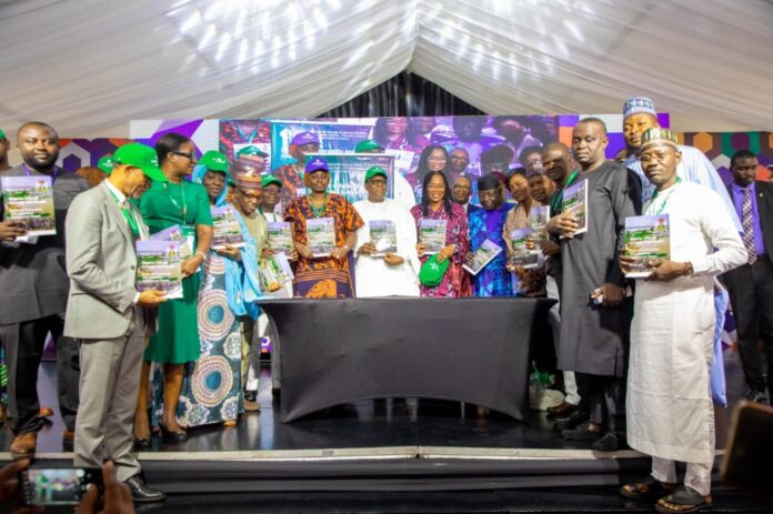 The Honourable Coordinating Minister for Health & Social Welfare Prof Muhammad Ali Pate launching the Nigeria Climate Change and Health Vulnerability Assessment Adaptation Report; on his right: Permanent Secretary Kachollom Daju mni; on her right is: Dr Okara Dogara, Technical Assistant to Permanent Secretary & other stakeholders/ participants at the JAR Conference.