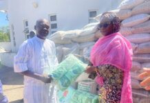 The Permanent Secretary, Dr. Maryam Ismaila Keshinro, handing over the relief materials to the representative of the Borno State Government.