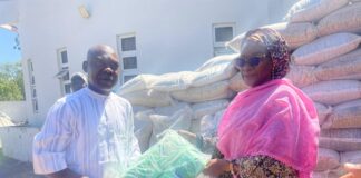 The Permanent Secretary, Dr. Maryam Ismaila Keshinro, handing over the relief materials to the representative of the Borno State Government.