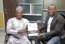 The Executive Secretary, National Commission for Persons with disabilities, Chief Ayuba Gufwan with the CEO Suntech Sunny Okachukwu.