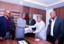 The President of Nigeria Universities Games Association (NUGA) Dr. Bawa Muhammed presenting souvenir to the Chairman of Nigeria Sports Commission, Mallam Shehu Dikko, during the Association's courtesy visit to the Chairman in his office recently in Abuja.