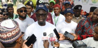 Minister of Youth Development, Comrade Olawande Ayodele (M), addressing the press during the commemoration of the Africa and National Youth Day celebration in Abuja on Friday (1/11/24). With him is the Permanent Secretary, Federal Ministry of Youth Development, Mr Olubunmi Olusanya (R).