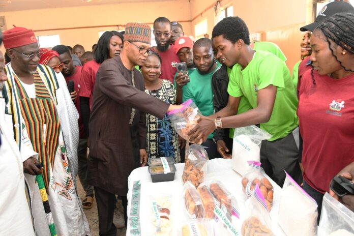 His Royal Highness, Ada Emmanuel Ajik, Adagwom of the Jos Izere Chiefdom, and the Permanent Secretary of the Ministry, Mr. Olubunmi Olusanya, inspecting the exhibition showcasing agricultural products from the training programme.