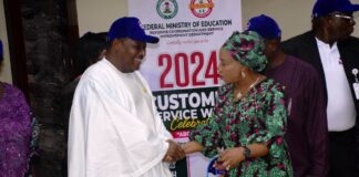 The National Coordinator/ CEO SERVICOM Presidency, Mrs Nnenna Akajemili in an handshake with the Permanent Secretary Federal Ministry of Education, Dr Nas'r Sani- Gwarzo, during the Ministry's year 2024 Customer Service Week Celebration in Abuja