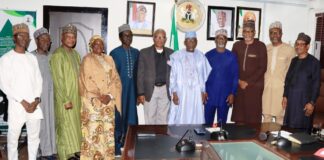 Minister of Labour and Employment, Dr. Muhammad Maigari Dingyadi (5th right); Director Overseeing the Office of the Permanent Secretary, John Nyamali (6th right); Executive Director, Mobil Producing Nigeria, Bala Aliyu (4th right) and members of his team with Directors of the Ministry during a courtesy visit by Mobil Producing Nigeria to the Minister, Abuja