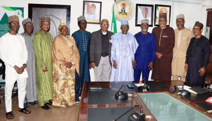 Minister of Labour and Employment, Dr. Muhammad Maigari Dingyadi (5th right); Director Overseeing the Office of the Permanent Secretary, John Nyamali (6th right); Executive Director, Mobil Producing Nigeria, Bala Aliyu (4th right) and members of his team with Directors of the Ministry during a courtesy visit by Mobil Producing Nigeria to the Minister, Abuja