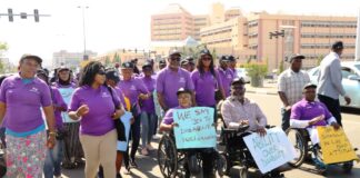 Executive Secretary, National Commission for Persons with Disabilities, Hon. Ayuba Burki Gufwan (right); Representative of the Senior Special Assistant to the President on Special Needs, Onah Chioma Emmanuel (2nd right), with members of staff of the Ministry and others during the roadshow to mark the 2024 International Day of Persons with Disabilities - Abuja