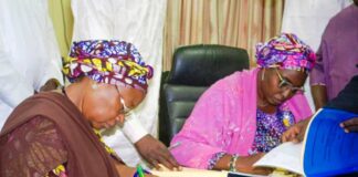 Signing of Memorandum of Understanding between the Federal Government and Adamawa State Government on the handover and conversion of Cottage Hospital Hong and General Hospital Mubi to Federal Medical Centres. L-R: The Deputy Governor of Adamawa State Prof. Kaletapwa Farauta signing the MoU; Permanent Secretary Federal Ministry of Health & Social Welfare Daju Kachollom mni, signs on behalf of the Federal Government.