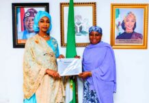 R-L H.E. Dr. Hajo Sani, OON Permanent Delegation of Nigeria to UNESCO presenting the inscription certificate of the Intangible Cultural Heritage of Durbar in Kano to Barr. Hannatu Musa Musawa Minister of Art, Culture, Tourism and the Creative Economy at the Ministry on the 17th of December 2024.