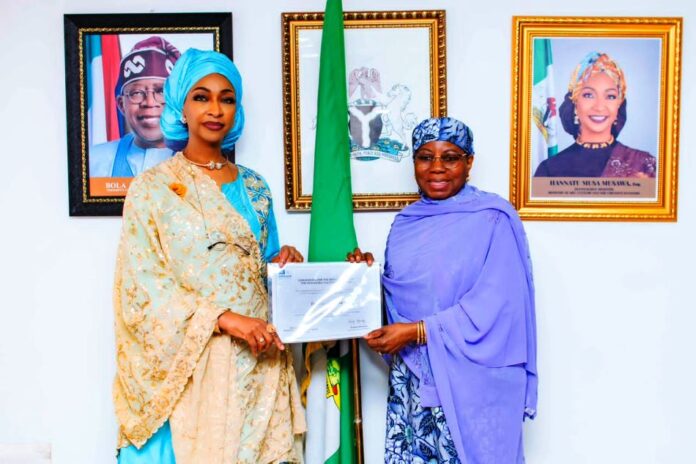 R-L H.E. Dr. Hajo Sani, OON Permanent Delegation of Nigeria to UNESCO presenting the inscription certificate of the Intangible Cultural Heritage of Durbar in Kano to Barr. Hannatu Musa Musawa Minister of Art, Culture, Tourism and the Creative Economy at the Ministry on the 17th of December 2024.