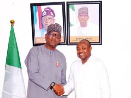 NSC Chairman Mallam Shehu Dikko in a warm handshake with Professional Footballers Association of Nigeria (PFAN) President Tijani Babangida.