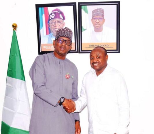 NSC Chairman Mallam Shehu Dikko in a warm handshake with Professional Footballers Association of Nigeria (PFAN) President Tijani Babangida.